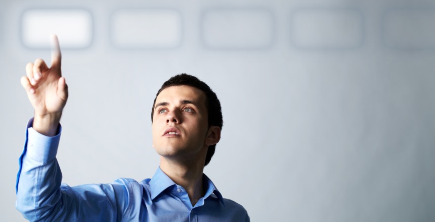 Image of creative young businessman pointing at virtual button