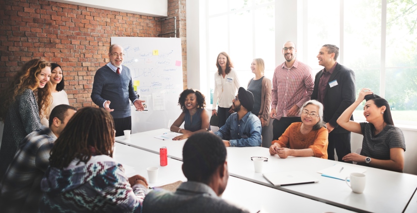 Leader with employees testing new management theory