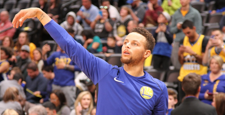 Steph Curry completing a warmup shot before a Golden State Warriors basketball game
